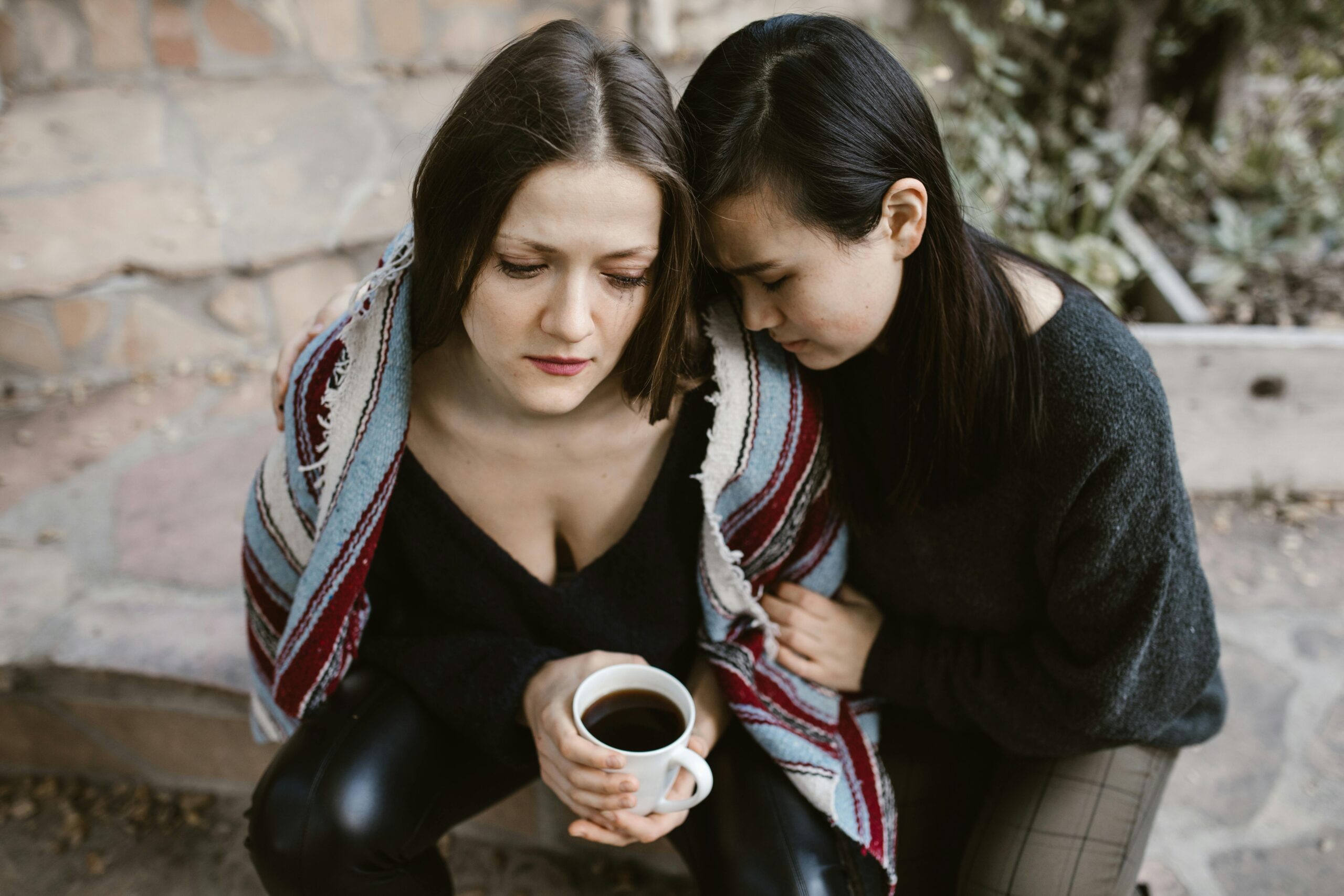 Two women talking about a sensitive subject.